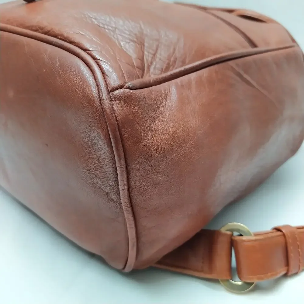 Perlina Brown Leather Zipper Pockets Flap Top Handle Drawstring Backpack
